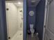 Modern bathroom with a walk-in shower, toilet, and stylish decor at 3209 S Dorchester Dr, Deltona, FL 32738