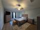 Comfortable bedroom with a ceiling fan, TV and matching furniture at 3209 S Dorchester Dr, Deltona, FL 32738