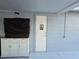 Exterior building with a restroom door next to an outdoor cabinet at 3209 S Dorchester Dr, Deltona, FL 32738