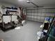 Spacious garage featuring ample storage, a two-car garage door, and plenty of room for fitness equipment at 3209 S Dorchester Dr, Deltona, FL 32738