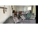 Living room featuring a gray sectional sofa and an open view to the kitchen at 3209 S Dorchester Dr, Deltona, FL 32738