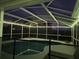 Screened pool with ambient lighting, offering a relaxing and inviting space for evening swims and gatherings at 3209 S Dorchester Dr, Deltona, FL 32738