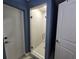 The bathroom features a walk-in shower with textured tile, glass door, and modern fixtures at 3209 S Dorchester Dr, Deltona, FL 32738