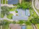 Aerial view of property near golf course and screened in pool at 369 Caddie Dr, Debary, FL 32713