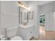 Bathroom featuring a vanity, mirror, and toilet at 369 Caddie Dr, Debary, FL 32713