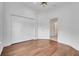 Bedroom features hardwood floors and a double-door closet at 369 Caddie Dr, Debary, FL 32713