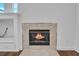 Tiled fireplace insert in a bright and open living room at 369 Caddie Dr, Debary, FL 32713