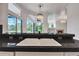 Kitchen with a large sink, black countertops, view of the pool and view of the fireplace at 369 Caddie Dr, Debary, FL 32713