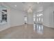 Bright living room with tiled floors, front door, and windows providing natural light and view at 369 Caddie Dr, Debary, FL 32713