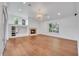 Open living room featuring a fireplace, chandelier and large windows at 369 Caddie Dr, Debary, FL 32713