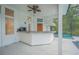 An outdoor bar with a built in grill area, and view of the pool at 369 Caddie Dr, Debary, FL 32713