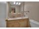 Well-lit bathroom with a vanity, a mirror, decorative touches, and a toilet at 37 Fairway Ct # C, Deland, FL 32724