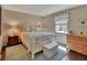 Cozy bedroom with a plush bed, soft lighting, and ample storage space at 37 Fairway Ct # C, Deland, FL 32724