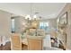 Elegant dining room with seating for six, stylish decor, and a view into the living area at 37 Fairway Ct # C, Deland, FL 32724
