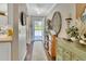 Hallway that flows into a modern kitchen with stylish decor and ample storage at 37 Fairway Ct # C, Deland, FL 32724