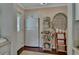Well-organized kitchen nook featuring a stainless steel refrigerator and decorative shelving at 37 Fairway Ct # C, Deland, FL 32724
