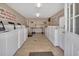 A well-lit laundry room provides multiple washers and dryers for the convenience of residents at 37 Fairway Ct # C, Deland, FL 32724