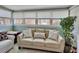 Inviting sunroom with neutral furniture and large windows, creating a bright and airy space at 37 Fairway Ct # C, Deland, FL 32724