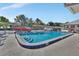Enjoy a refreshing swim in this beautiful pool, surrounded by lush landscaping and ample lounging space at 37 Fairway Ct # C, Deland, FL 32724