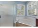 Bright bathroom with a corner tub and a separate glass shower at 376 Chelsea Place Ave, Ormond Beach, FL 32174