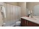 Neutral bathroom with a shower-tub combo, single sink vanity, and white towels at 376 Chelsea Place Ave, Ormond Beach, FL 32174