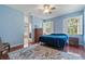 Comfortable primary bedroom with hardwood floors and large windows at 376 Chelsea Place Ave, Ormond Beach, FL 32174