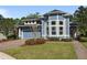 Charming single-Gathering home with manicured front lawn, well-maintained landscaping, and attached garage at 376 Chelsea Place Ave, Ormond Beach, FL 32174