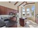Bright kitchen with dark cabinets, stainless steel appliances and a center island, with lovely natural light at 376 Chelsea Place Ave, Ormond Beach, FL 32174