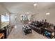 Spacious living room featuring a plush rug, leather sofa and TV for comfortable entertaining at 376 Chelsea Place Ave, Ormond Beach, FL 32174