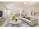Bright and airy living room with neutral tones, modern decor, and lots of natural light creates a welcoming atmosphere at 376 Chelsea Place Ave, Ormond Beach, FL 32174