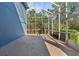 Large screened-in porch with views of the backyard and natural sunlight at 376 Chelsea Place Ave, Ormond Beach, FL 32174