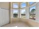 A brightly lit sitting room features large windows with shutters and a view to the outdoors at 376 Chelsea Place Ave, Ormond Beach, FL 32174