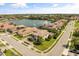 Aerial view of home in a beautiful neighborhood featuring a waterfront lot and meticulously kept landscaping at 3955 Equine Cv, Lake Mary, FL 32746