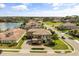Aerial view of the home showing a spacious manicured front yard and brick driveway at 3955 Equine Cv, Lake Mary, FL 32746