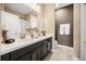 Charming bathroom featuring double sinks with a modern vanity and fixtures, and a bath and shower combo at 3955 Equine Cv, Lake Mary, FL 32746