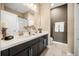 Stylish bathroom featuring double sinks, modern fixtures, and elegant decor at 3955 Equine Cv, Lake Mary, FL 32746