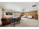 Spacious bedroom featuring two beds, a cozy seating area, and modern decor at 3955 Equine Cv, Lake Mary, FL 32746