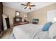 Comfortable bedroom with a plush bed, wooden furniture, and relaxing decor at 3955 Equine Cv, Lake Mary, FL 32746