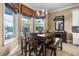 Eat-in dining area features a large picture window, views of the outdoors, and a modern chandelier at 3955 Equine Cv, Lake Mary, FL 32746