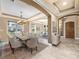 Elegant dining room with modern chandelier and large window views at 3955 Equine Cv, Lake Mary, FL 32746