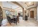 Formal dining room showcasing a large wooden table, chairs, and an open floor plan at 3955 Equine Cv, Lake Mary, FL 32746