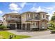 Beautiful residence showcases a multi-car garage, stone detailing, and well-maintained landscaping at 3955 Equine Cv, Lake Mary, FL 32746