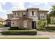 Beautiful two-story home featuring manicured landscaping, a tile roof, and a welcoming entrance at 3955 Equine Cv, Lake Mary, FL 32746