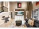 Spacious living room with a decorative television console, comfortable seating, and staircase access at 3955 Equine Cv, Lake Mary, FL 32746