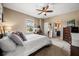 Relaxing bedroom with a cozy bed, a charming makeup vanity, and a private ensuite bathroom at 3955 Equine Cv, Lake Mary, FL 32746
