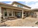 Spacious outdoor patio with a dining area, outdoor kitchen, and lounge seating at 3955 Equine Cv, Lake Mary, FL 32746