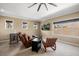 Inviting sitting room with a comfortable leather recliner, carpet flooring, and plenty of natural light at 3955 Equine Cv, Lake Mary, FL 32746