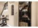 View of a wine cellar with wrought iron gate and window, and beige walls at 3955 Equine Cv, Lake Mary, FL 32746