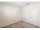 Neutral bedroom offers plush carpet, double closets, and room for relaxation at 406 Ravenshill Way, Deland, FL 32724