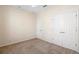 This bedroom has neutral carpet, baseboards, and paint with ample closet space at 406 Ravenshill Way, Deland, FL 32724